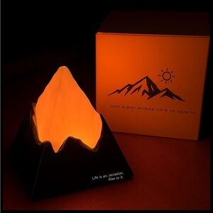 Mountain Night Light with Warm Orange Glow